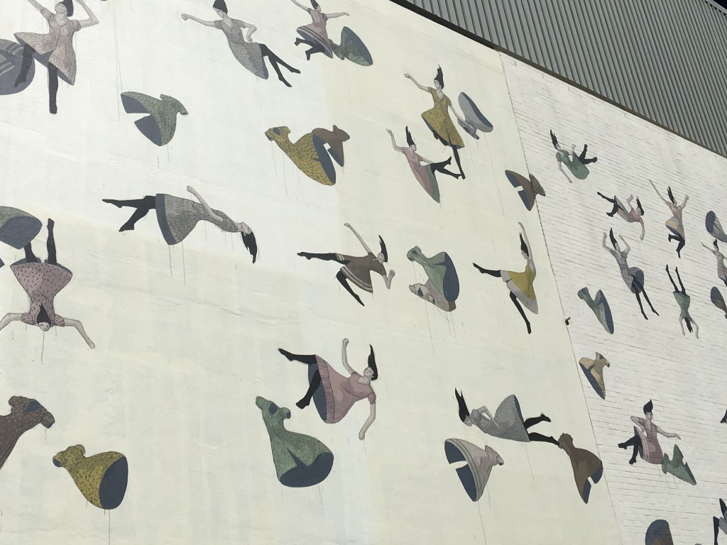 wall mural of girls falling through the air