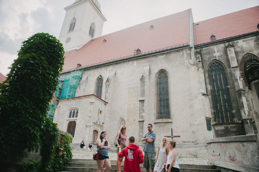 travellers out front of an historic church in Bratislava