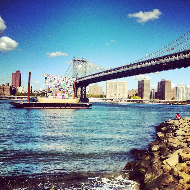 Brooklyn Bridge view over water with skyline