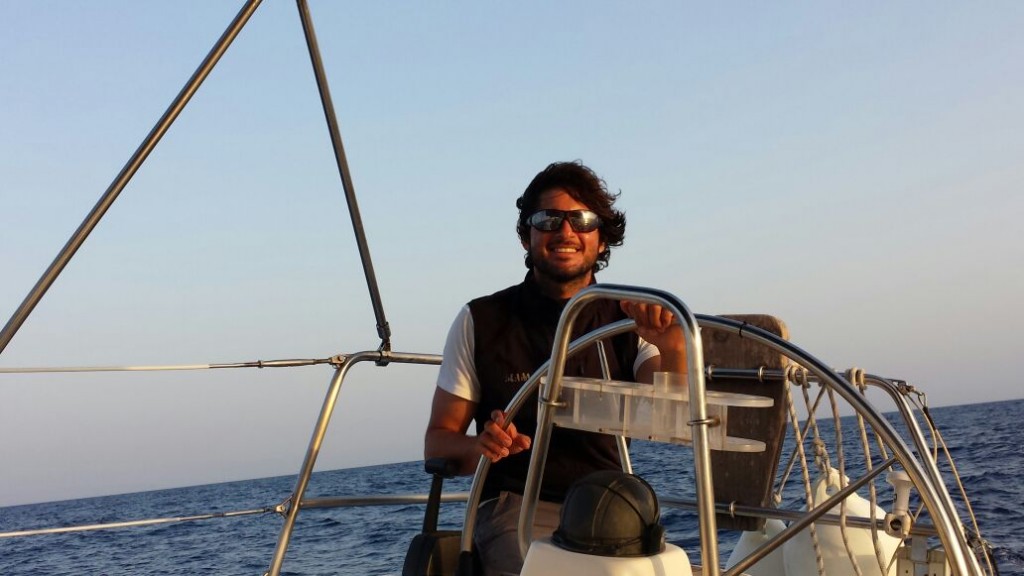 sailor steering a boat near Mallorca