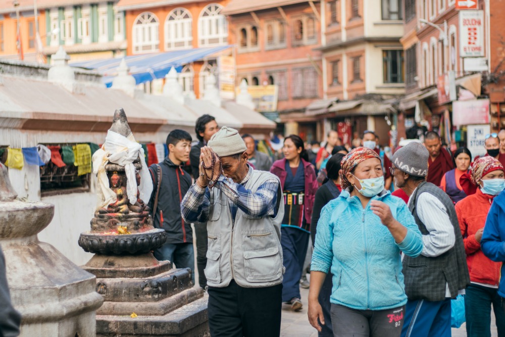 Praying at Boudhanath Stupa Kathmandu