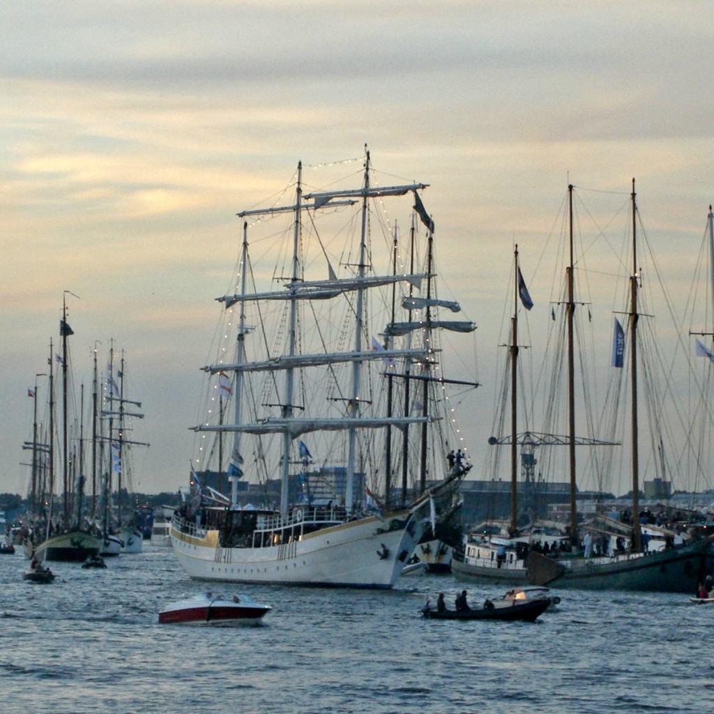 sailing boats on the water at dusk