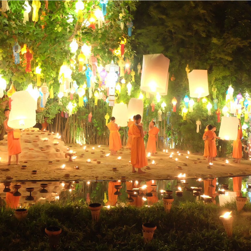 monks with lanterns at the chiang mai festival
