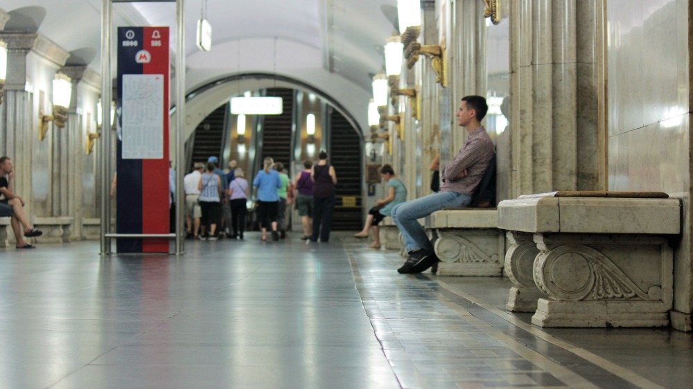 Man sitting in the metro station in Moscow