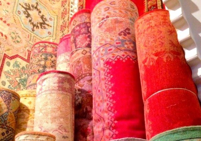 rolls of carpets in the marrakech medina